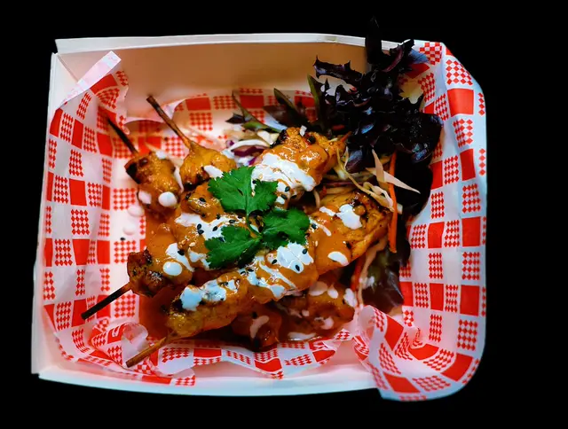 Two Sisters chicken satay skewers first-party photograph